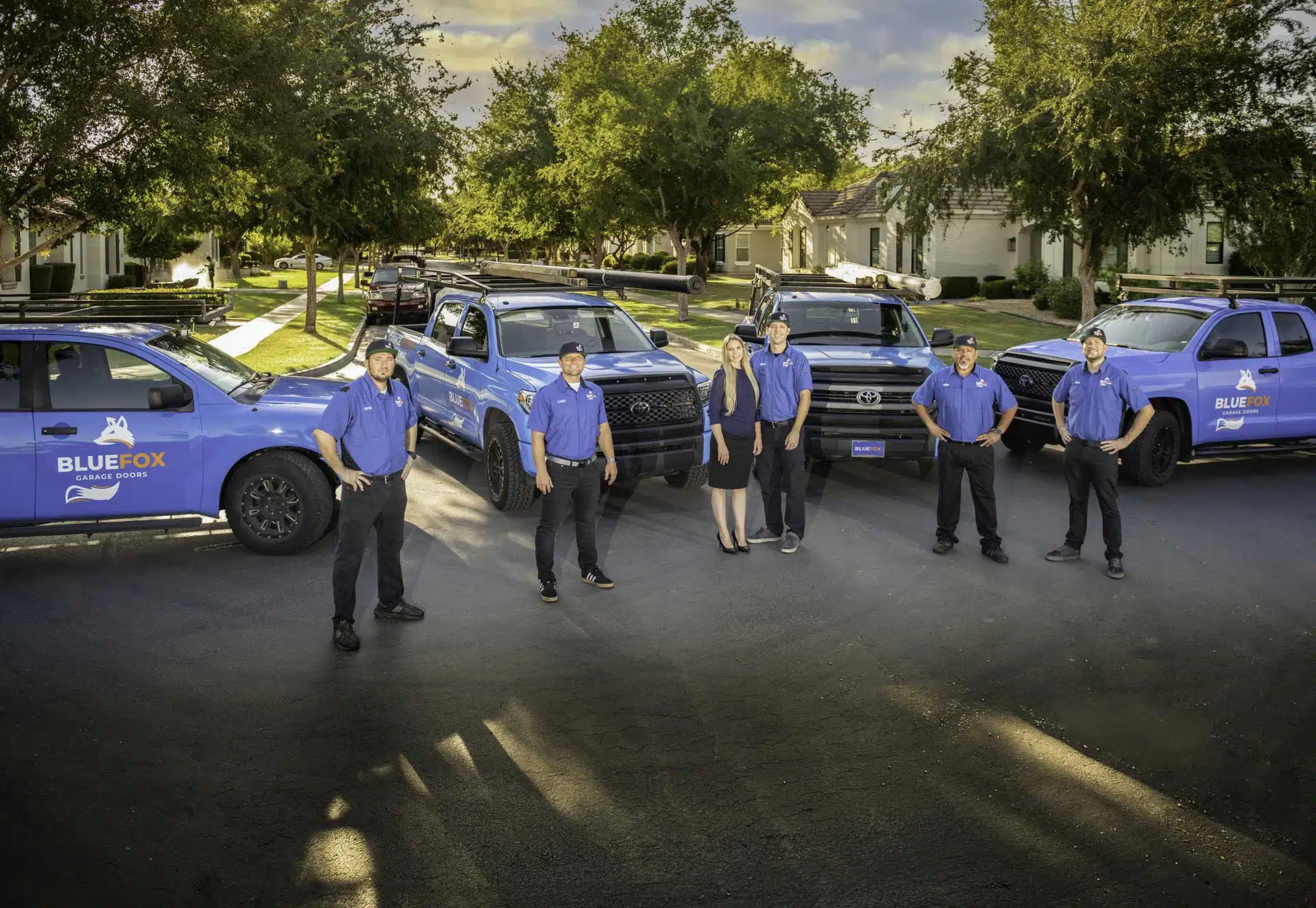 The Blue Fox Garage Doors team with their service trucks